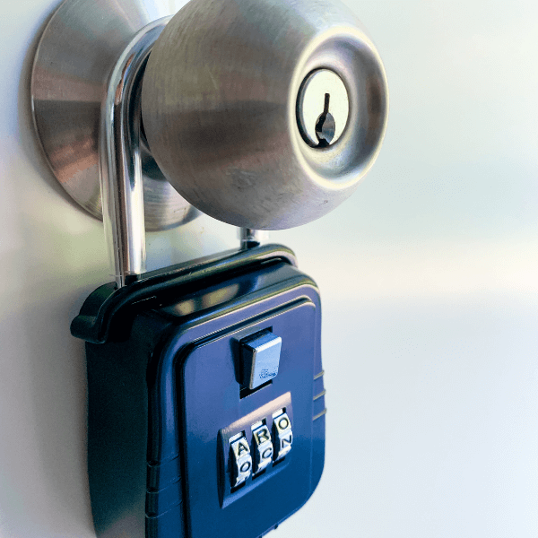 Locksmith in Johnson City Tennessee - Keeping Your Home Secure While It is on the Market - blue lockbox attached to doorknob similar to what realstors use