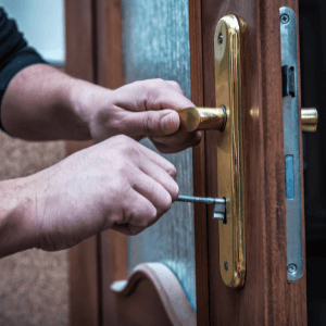locksmith tri cities - Mistakes and Misconceptions You Should Avoid About Locks - a pair of hands opening a lever door handle