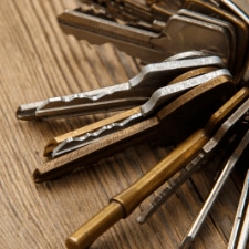 where can i get keys cut locally - The Benefits of Having a Master Key for Your Business - a key holder holding a bunch of brass and silver keys