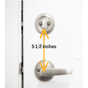 commercial locksmith Kingsport - The Benefits of Installing Deadbolts - a doorknob and deadbolt with a double arrow indicating their distance from each other