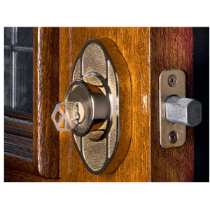 key cutting Tri-Cities - Single or Double-Cylinder Deadbolts on Your Doors - a brass double cylinder deadbolt showing a key in the slot