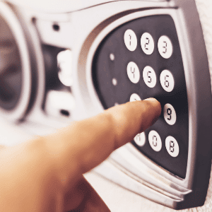 nearest locksmith - a smart lock featuring a keypad with a finger pressing on number 8