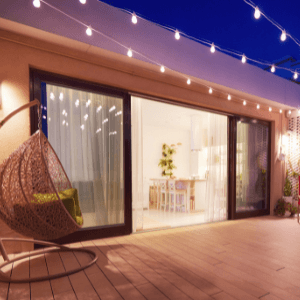 nearest locksmith - sliding glass door that opens to a huge deck with string of lights and a chair swing